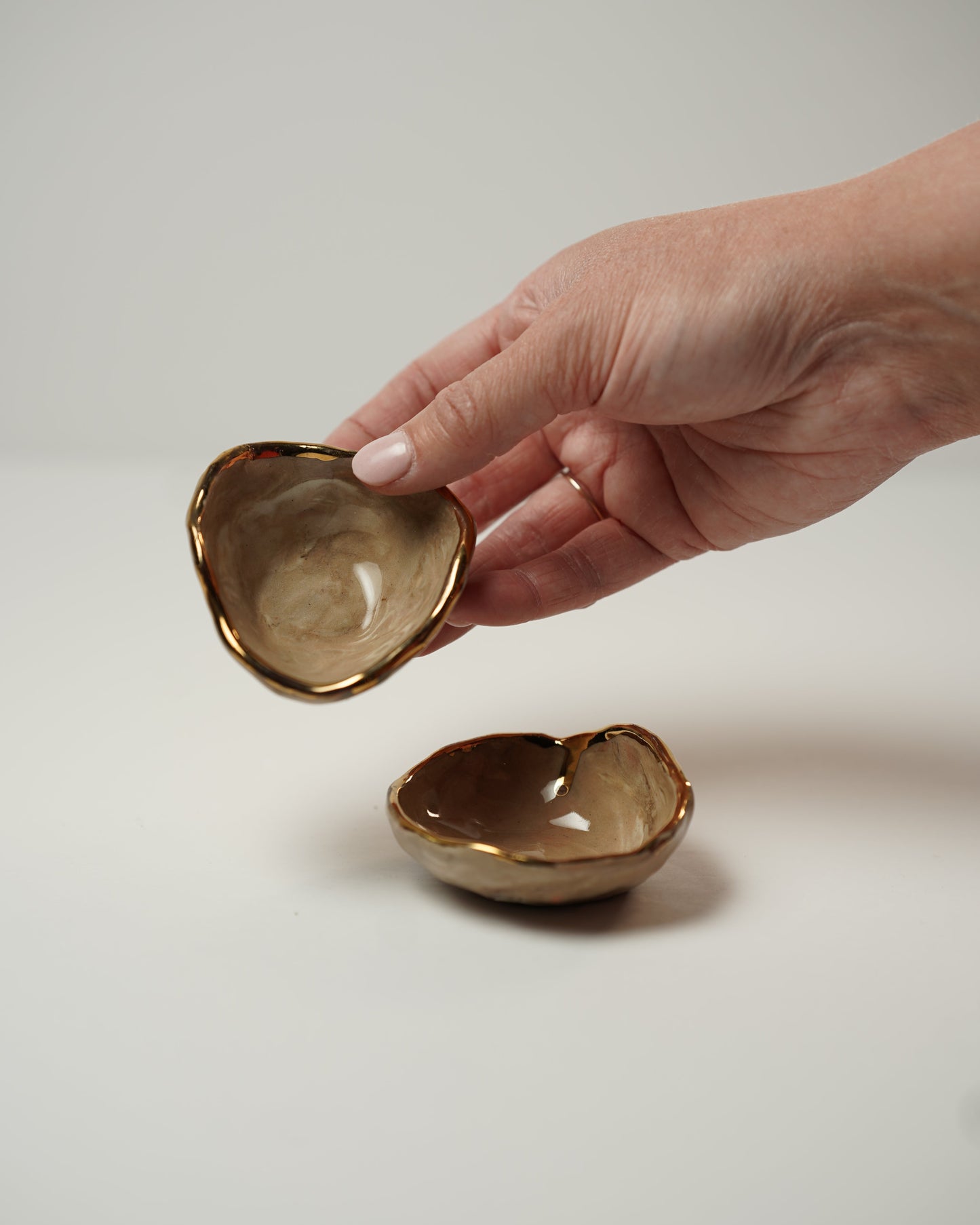 Two Golden Trinket Dishes