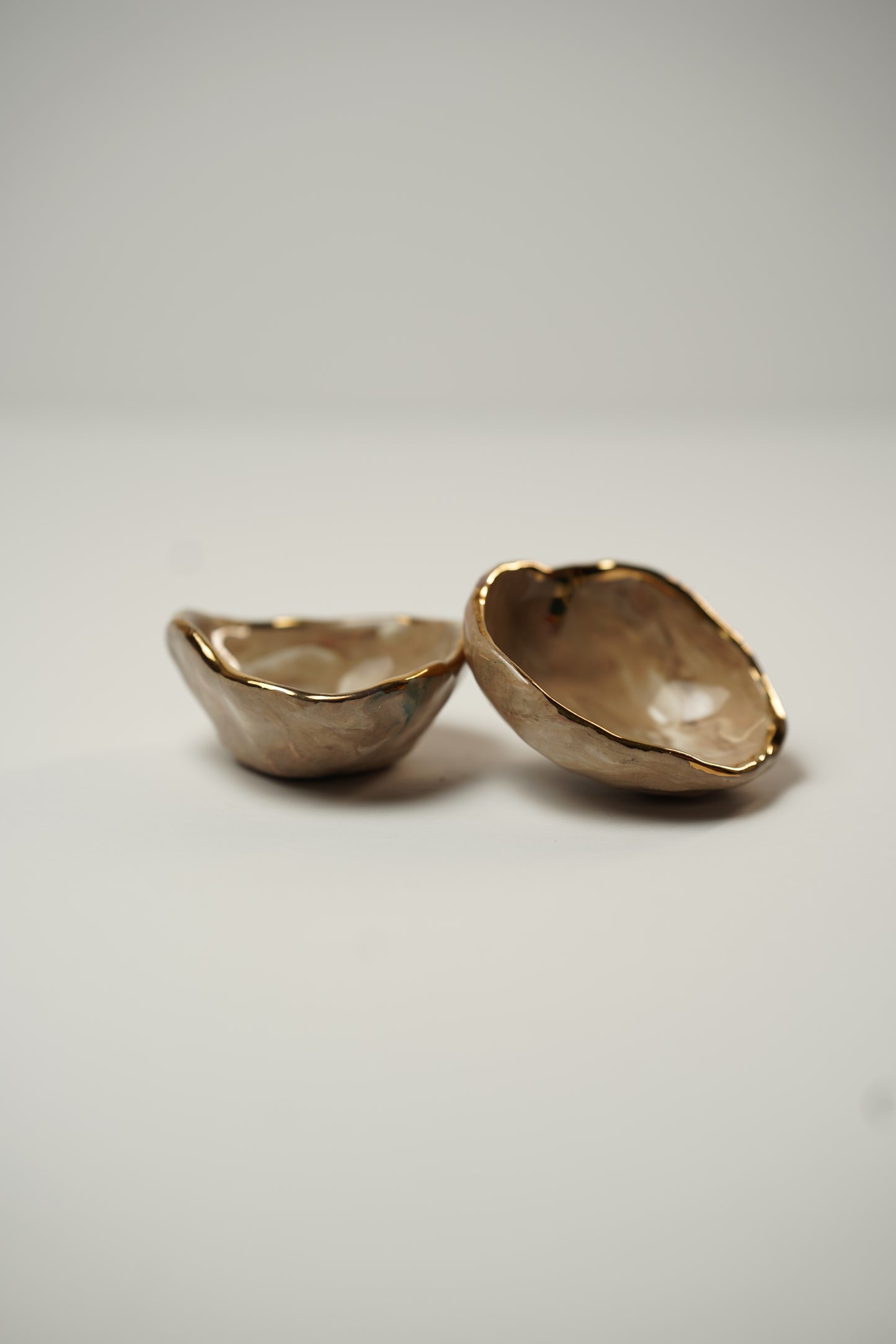 Two Golden Trinket Dishes